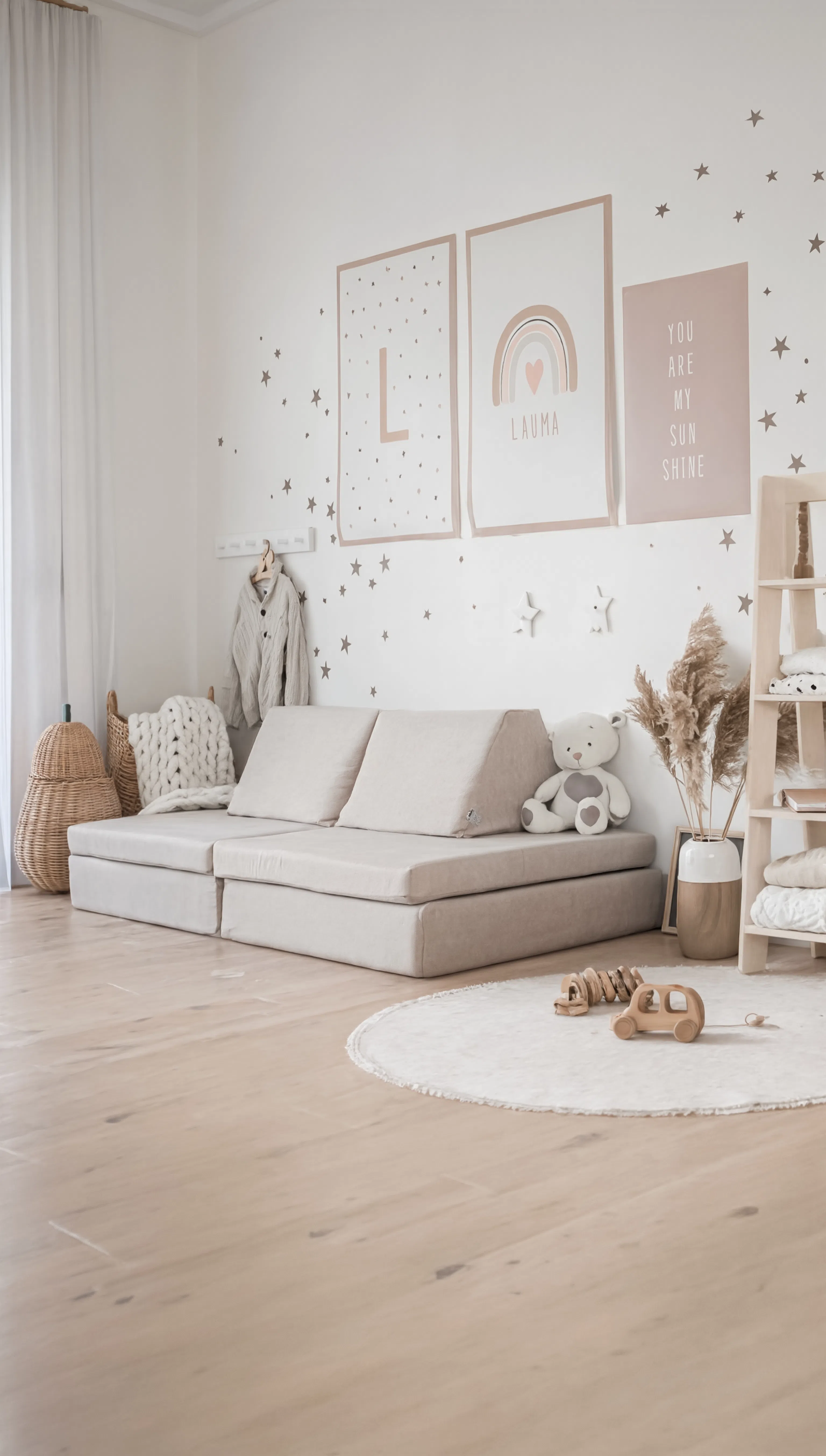 Children's room with a beige sectional sofa, teddy bear, and decorative elements.