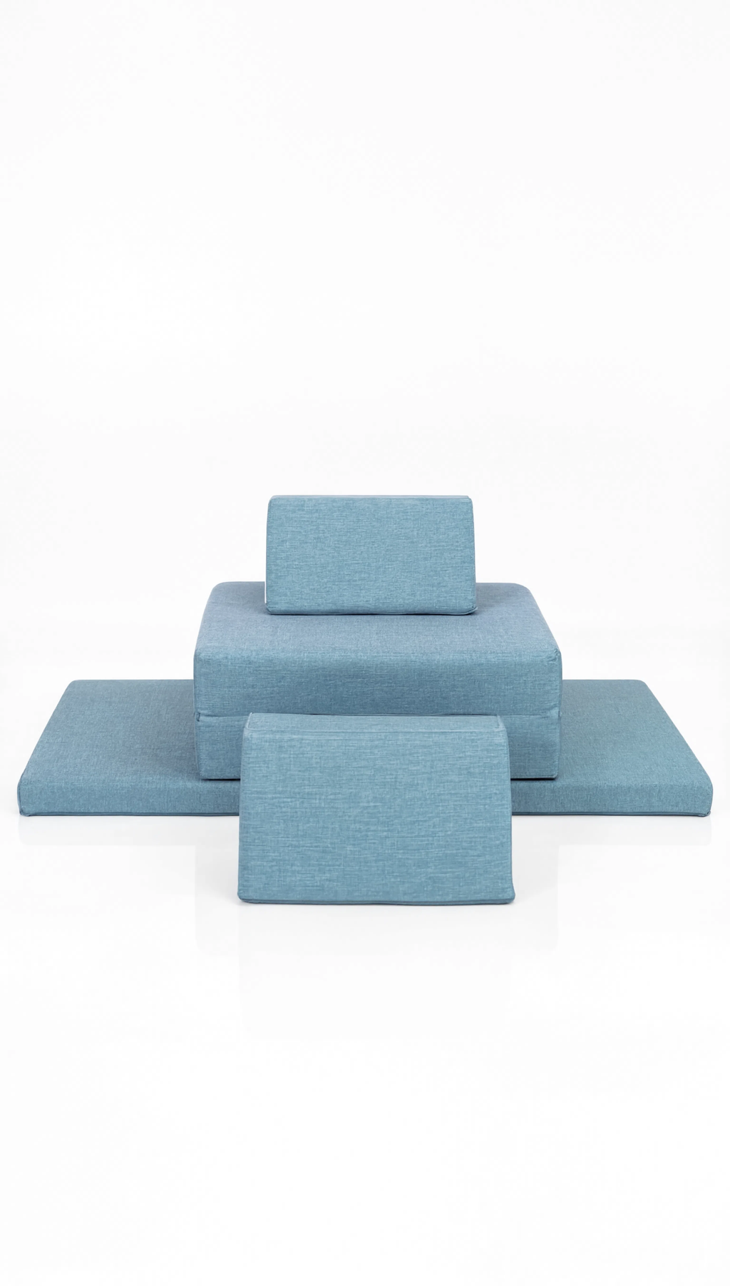 Set of blue bed sheets and pillowcases on a white background