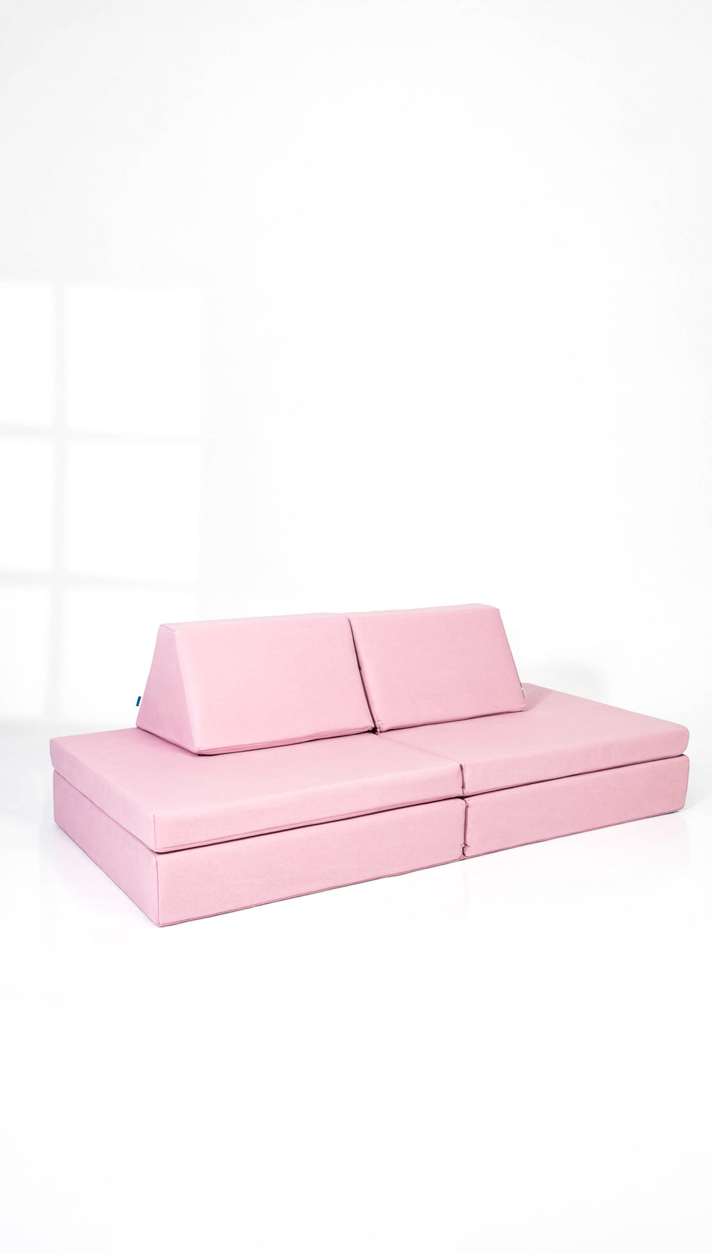 Pink sofa on a white background