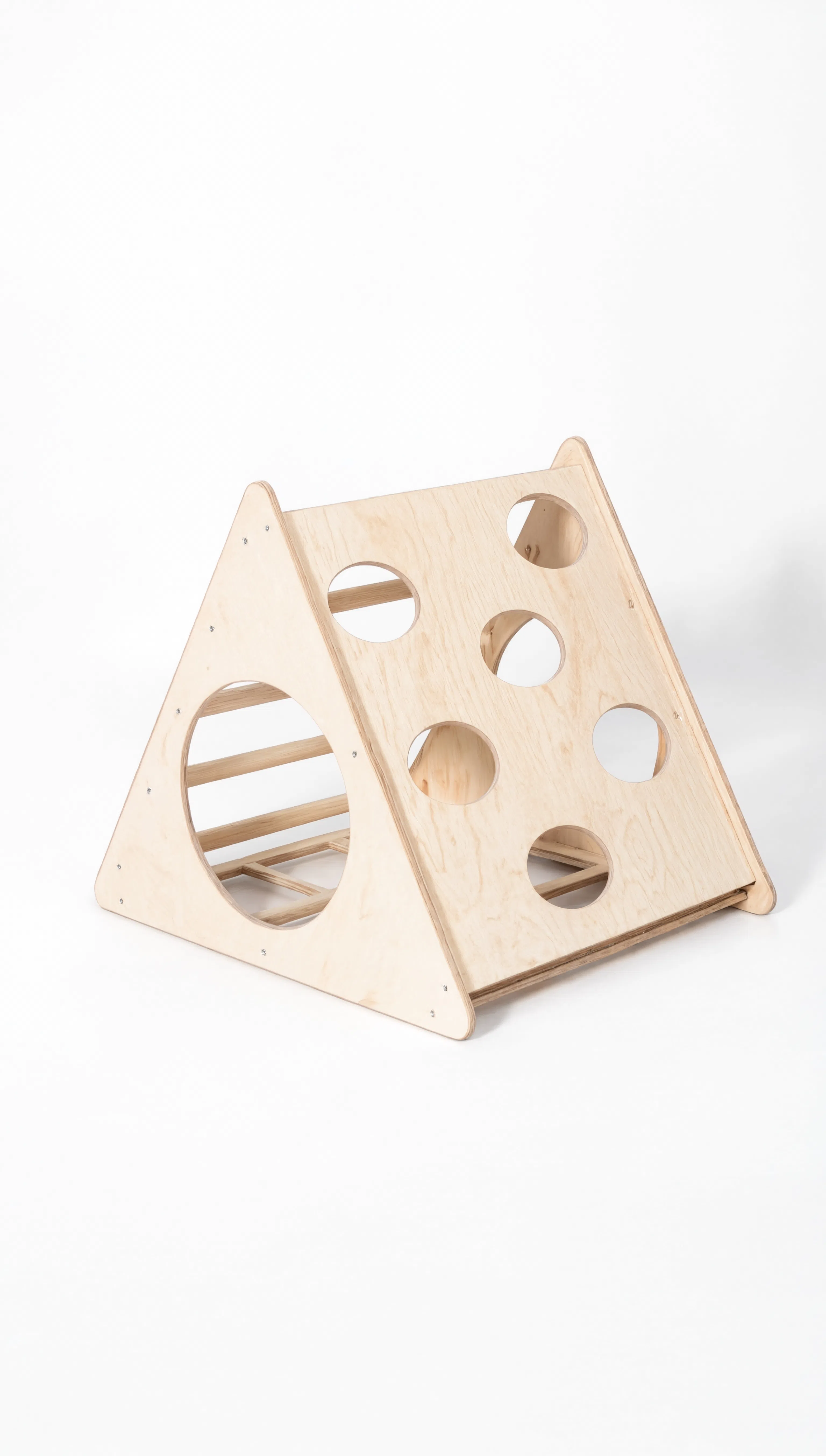 Wooden triangular toy with circular holes on a white background